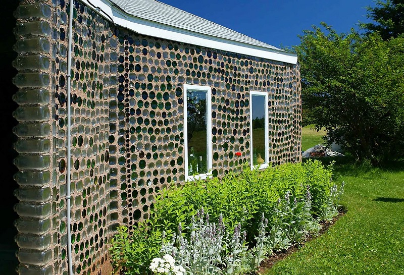 House with glass bottle wall