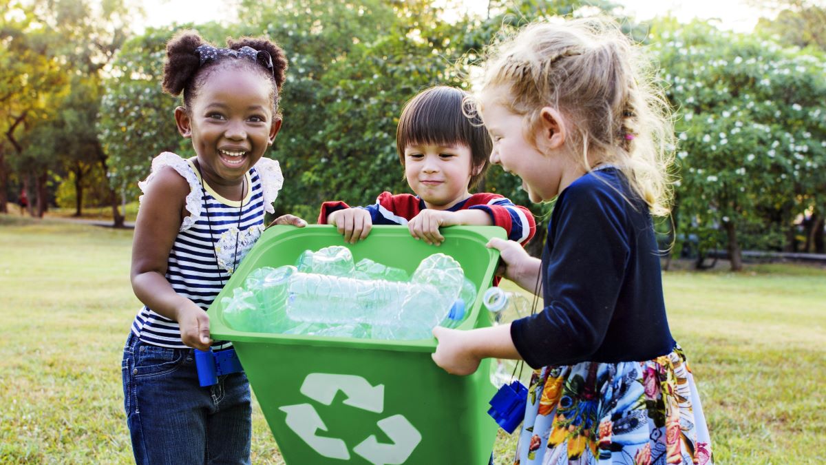 Young children recycling