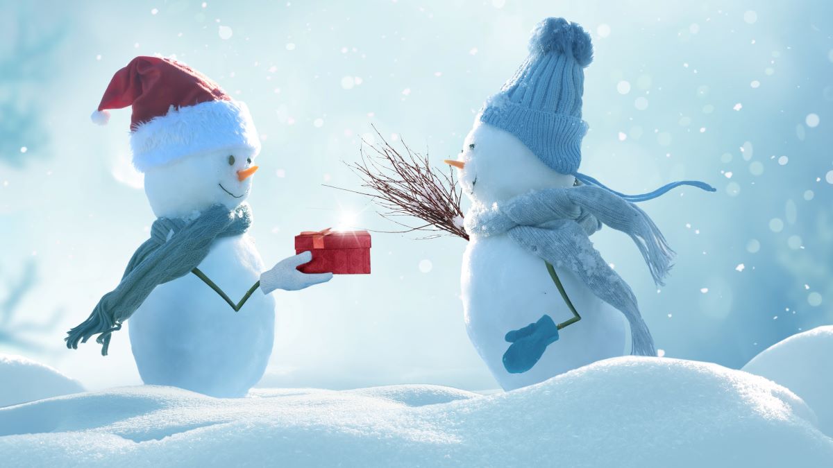 two snowmen exchanging a gift