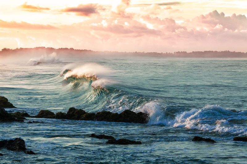 ocean waves breaking along a rocky coastline