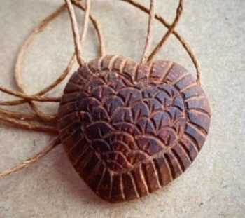 Heart-shaped pendant carved from avocado heart from Anna Ark, Etsy