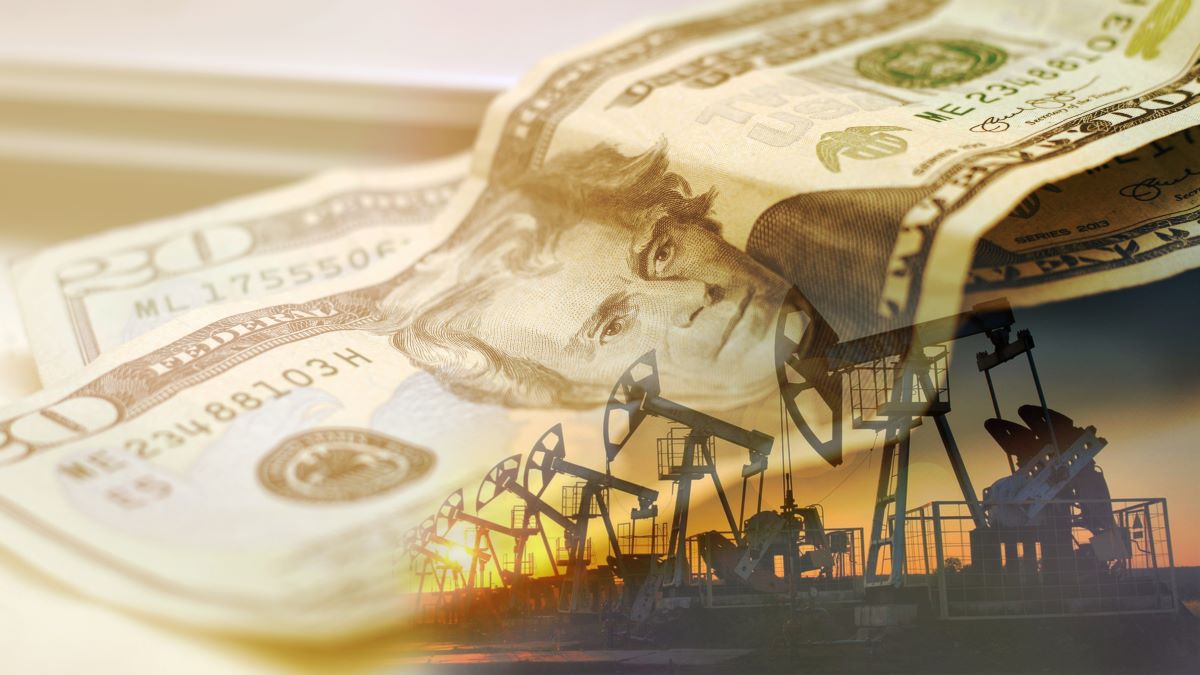 oil pumps on background of U.S. currency
