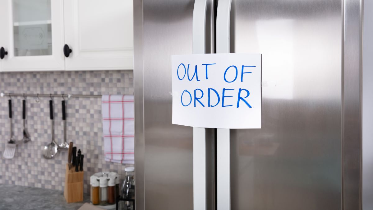 "Out of order" sign taped on refrigerator