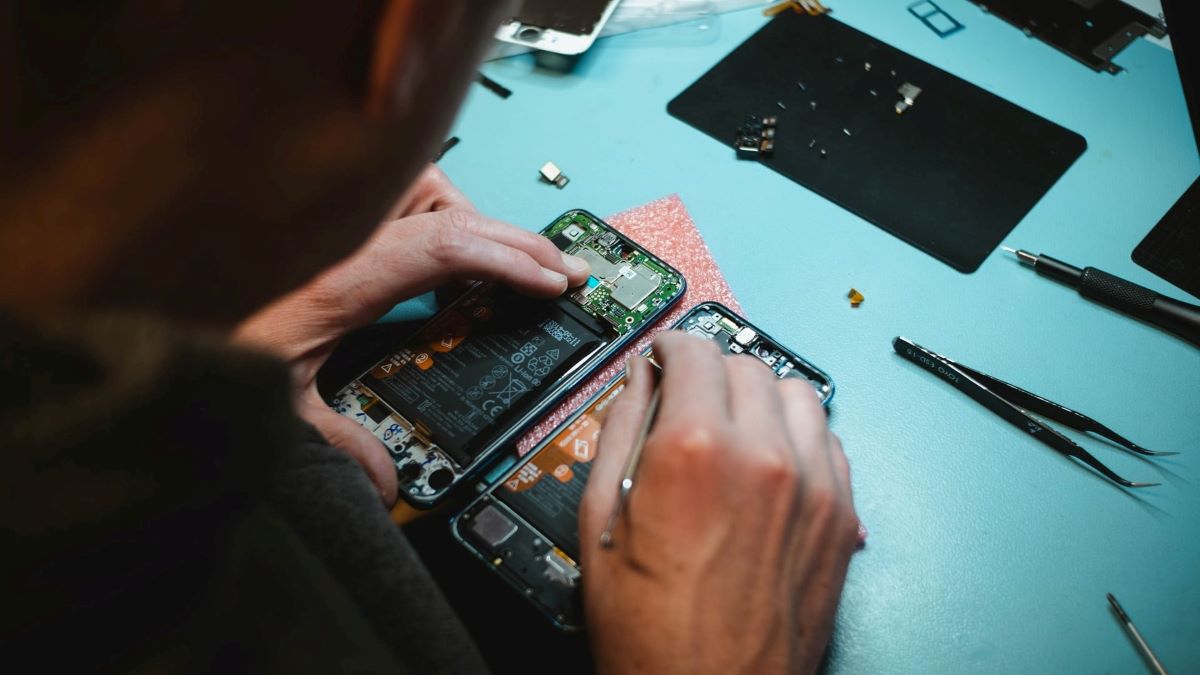 Man repairing smartphone