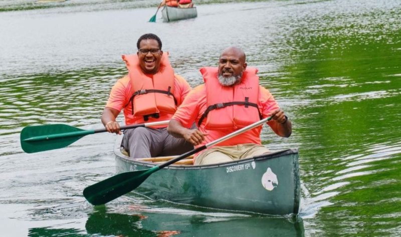 Two Black men canoeing