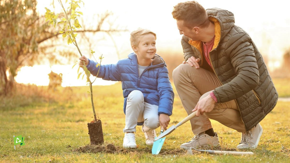 boy and father planting a tree